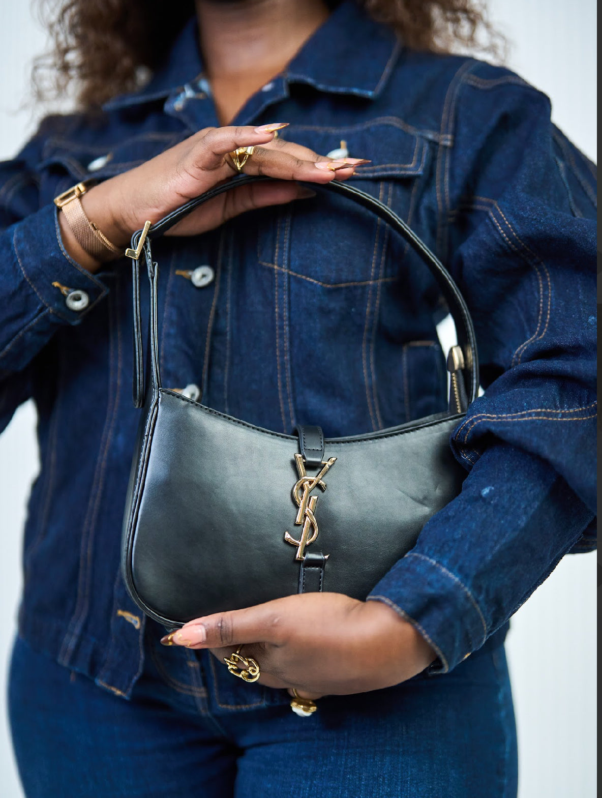 Black YSL bag with a touch of glold